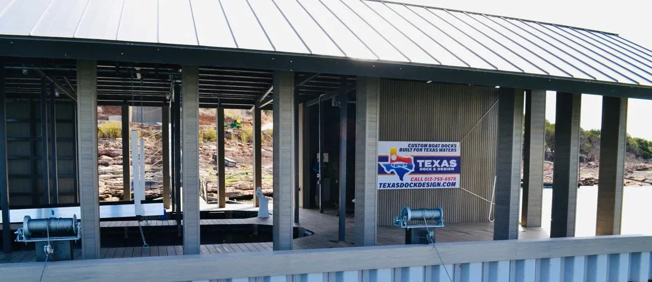 Front elevation of the boathouse showing the slips, columns and metal roof